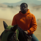 OJ on a horse in the field